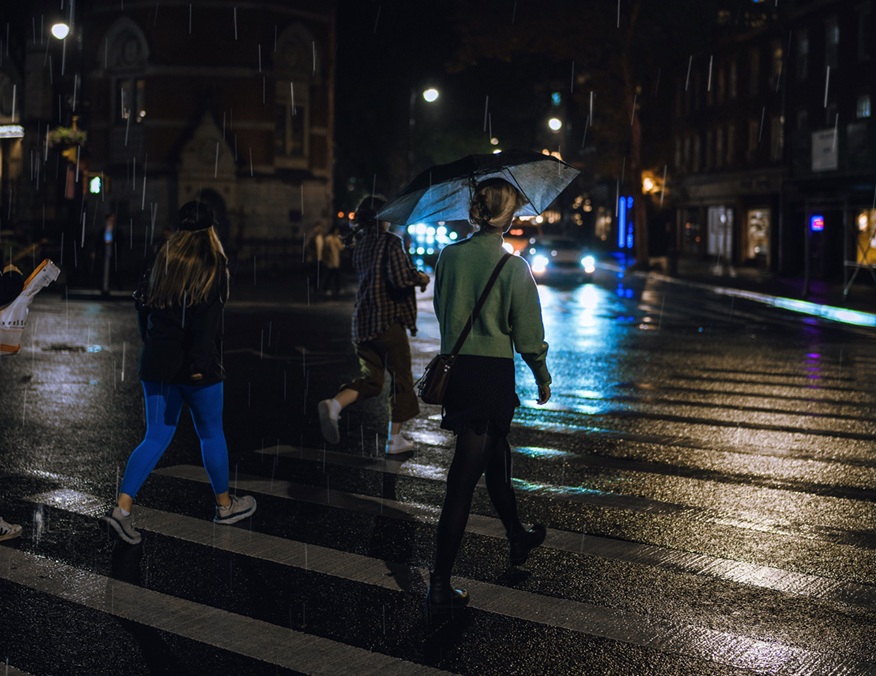 Pedestrians walking across crosswalk